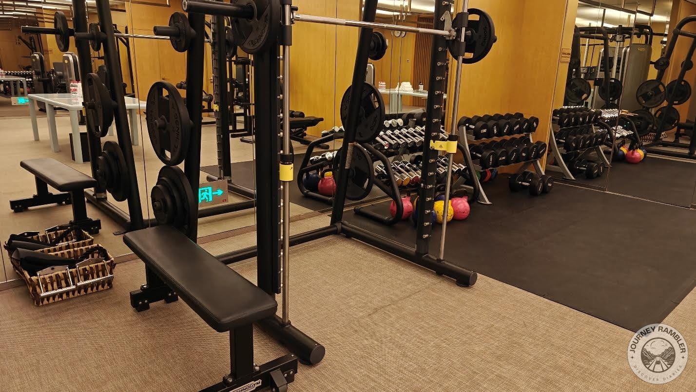 exercise bench right next to it and a big mirror