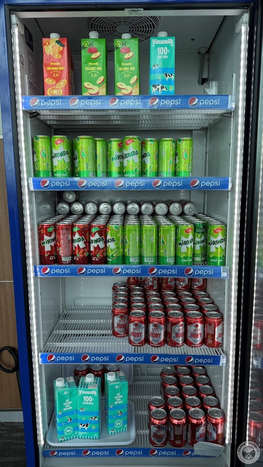 freezer held milk and cans of soda