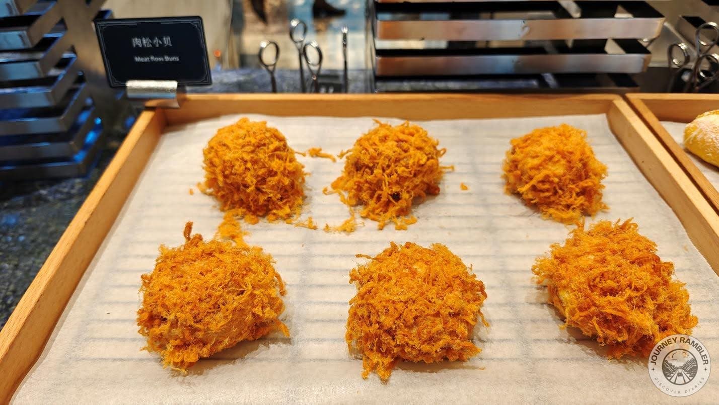 fresh bakery items were served on wooden trays