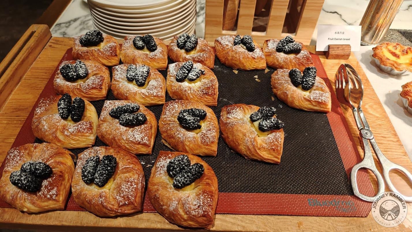fruit Danishes were topped by berries and powdered sugar