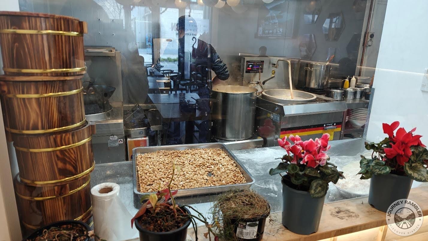 glass wall between the restaurant and the kitchen