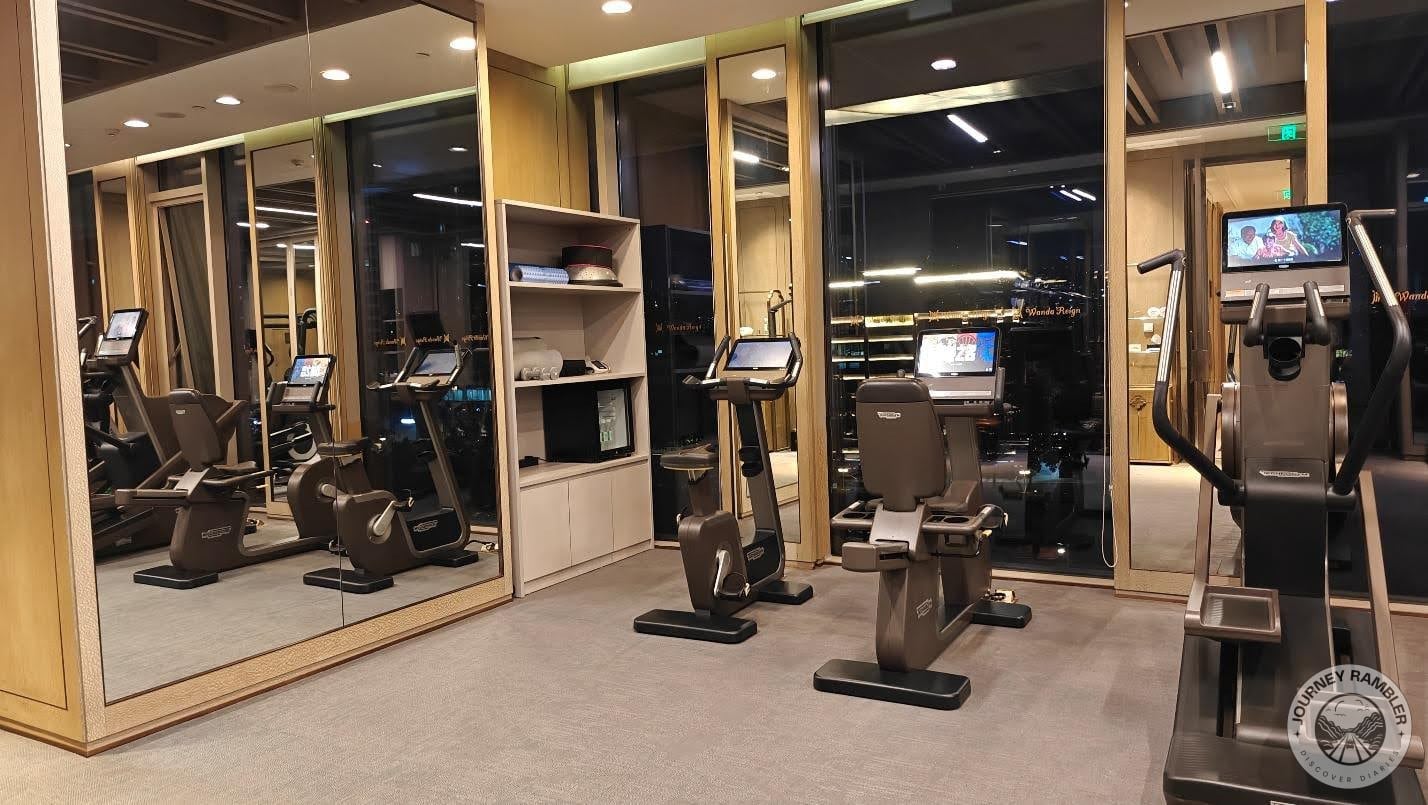 gym had big windows and mirrors on all sides of the room