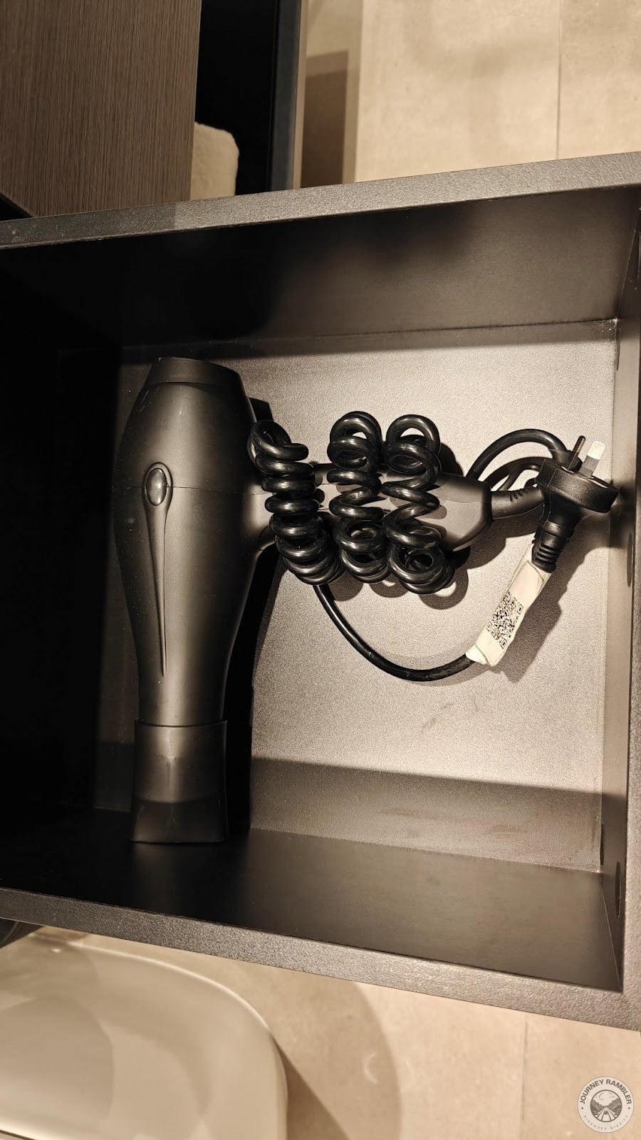 hairdryer tucked away inside a cupboard