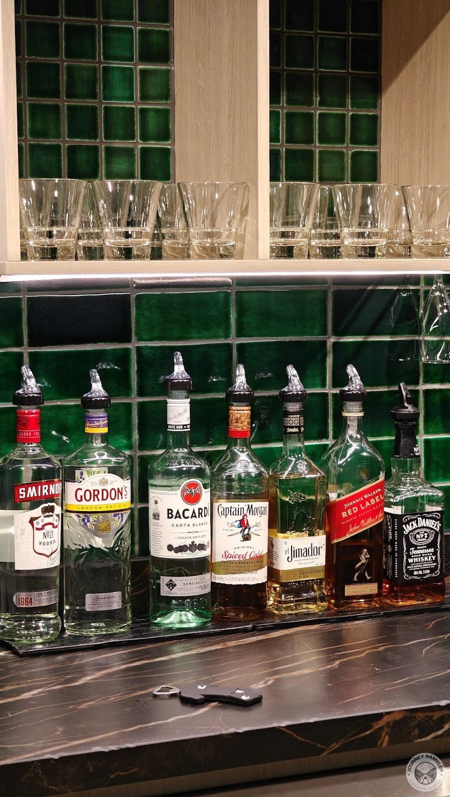 half finished bottles of whiskey, gin, white rum and vodka