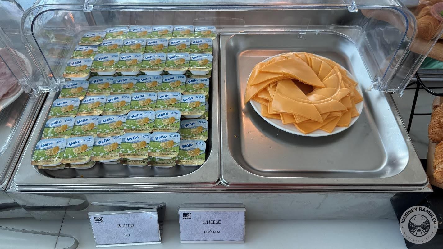 little individual sized containers of butter and cheese sliced into thin triangles