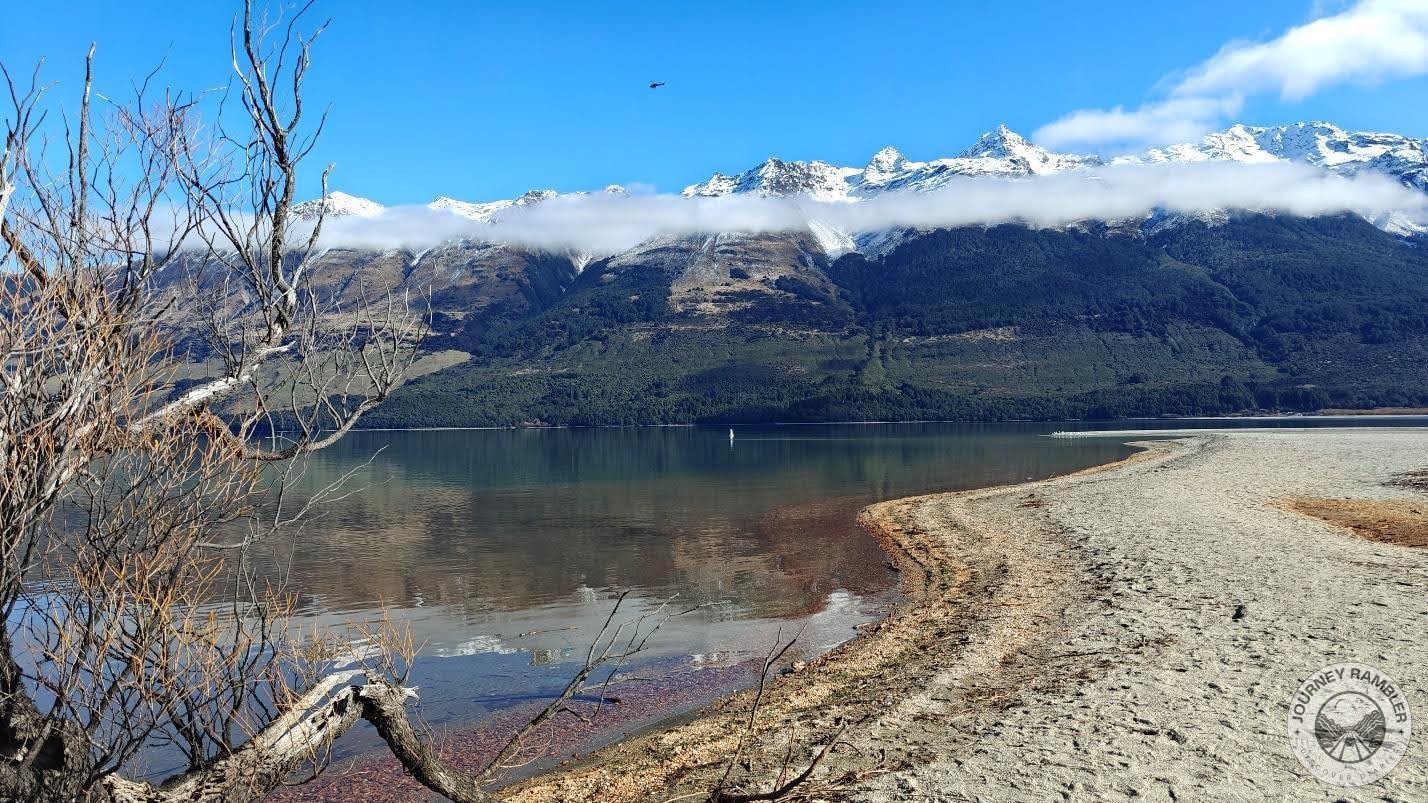 mountains surrounding the lake capped with snow
