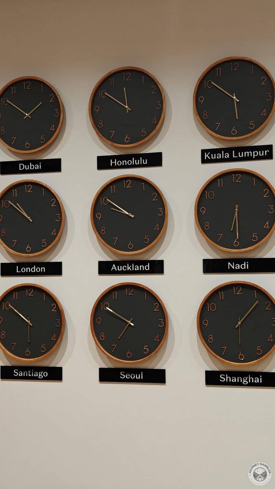 nine clocks on the wall in the lobby