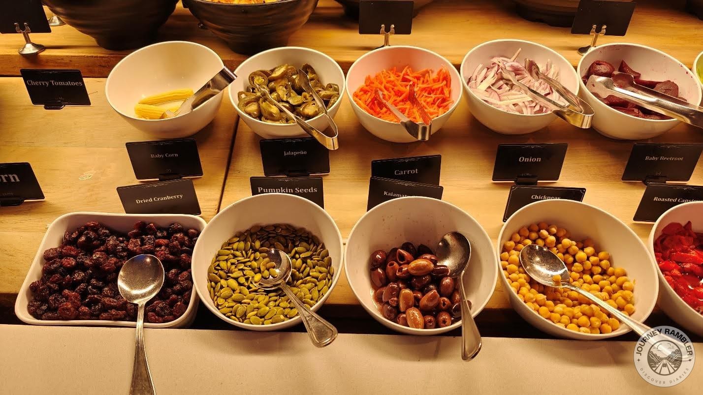 olives, carrots, onions, jalapenos, chickpeas, baby corn, pumpkin seeds and dried cranberry