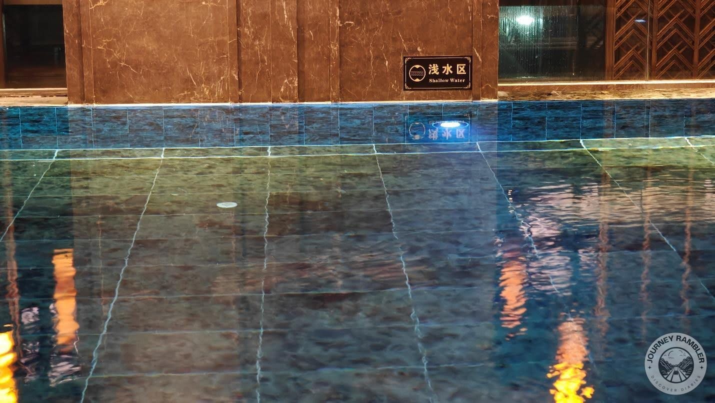 overhead lights were reflected off the water