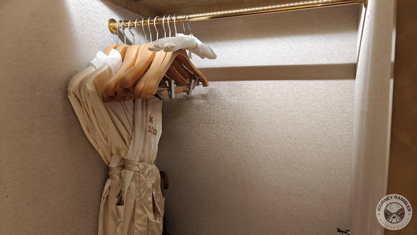 pair of bathrobes and some extra clothes hangers