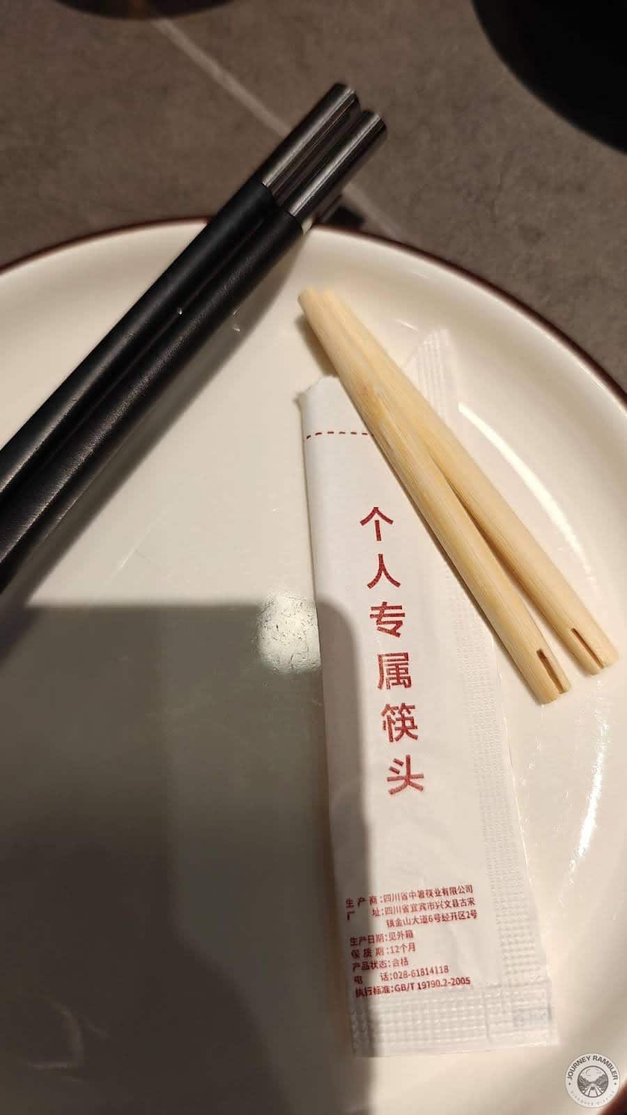 plate and pairs of wooden chopsticks
