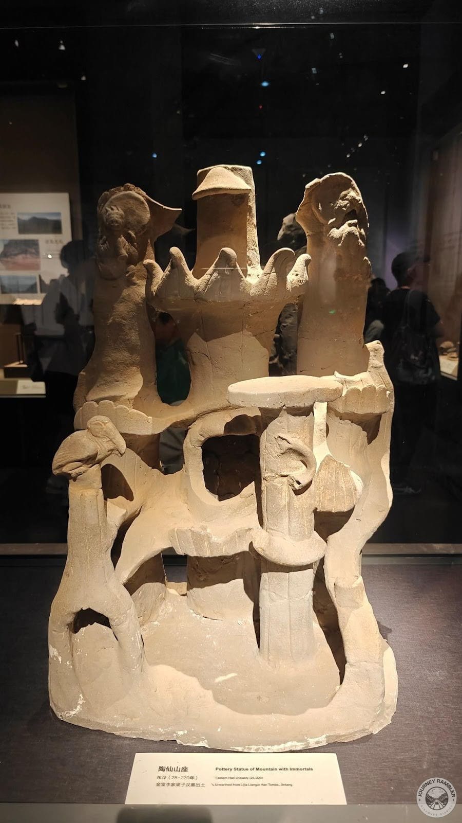 pottery statue of a mountain with immortals