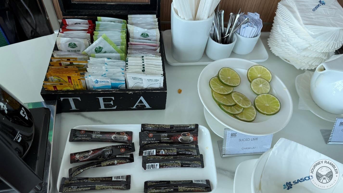 sachets of tea and instant coffee and slices of limes