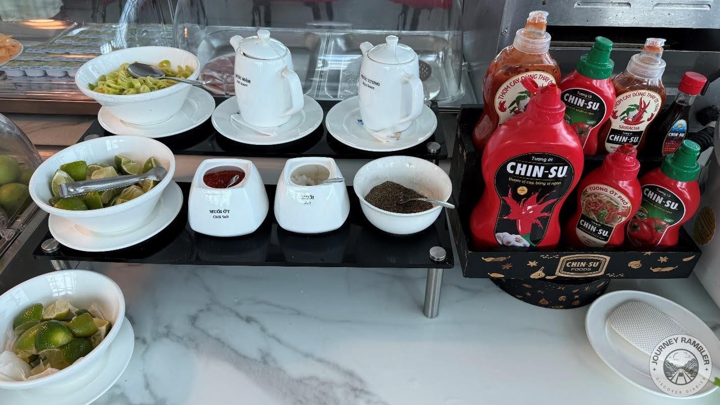 salt, pepper, lemon wedges and lots of different kinds of sauces