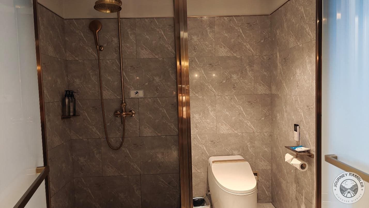 shower and the toilet area were separated by a wall in the middle