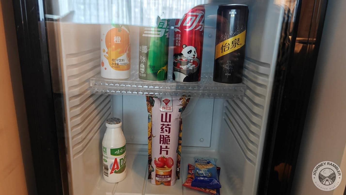 some drinks and energy bars inside the fridge