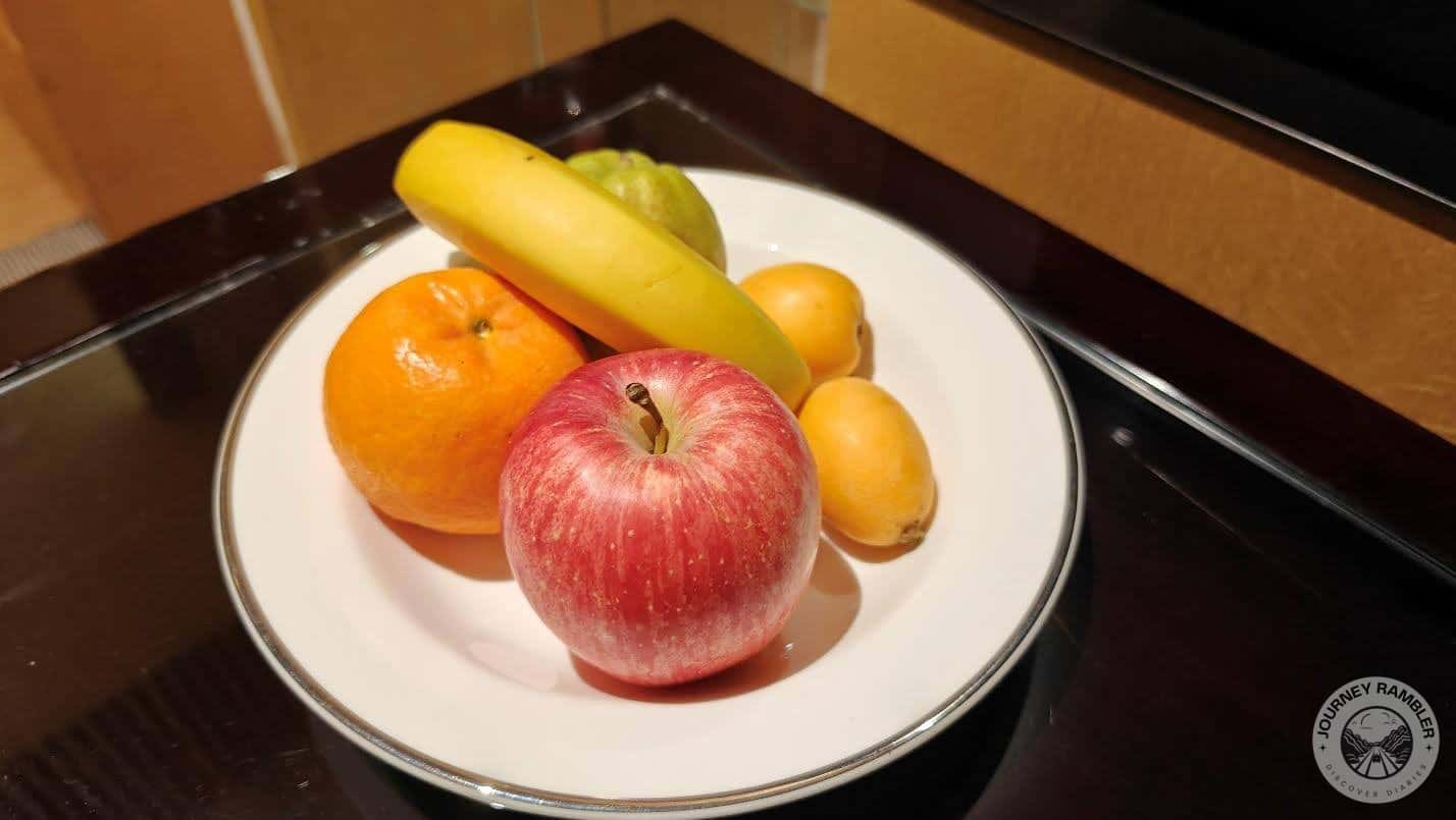 some fresh fruits like apples, bananas and oranges