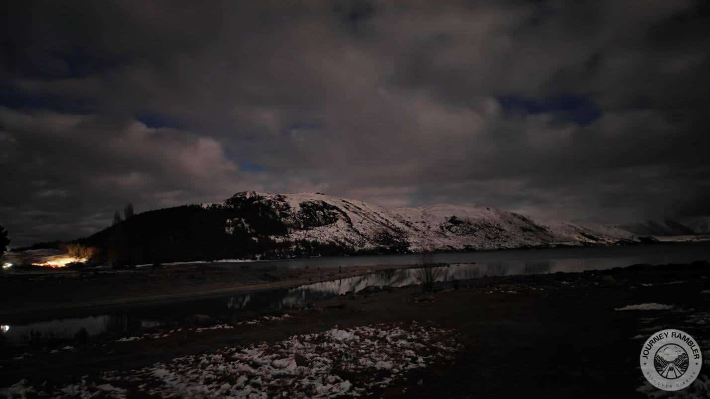 some lights from the town in the distance