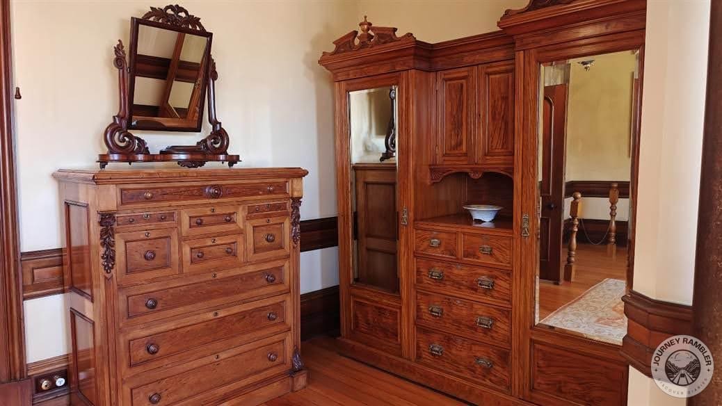 some of the furniture that you’ll find here in what I think is the master’s bedroom