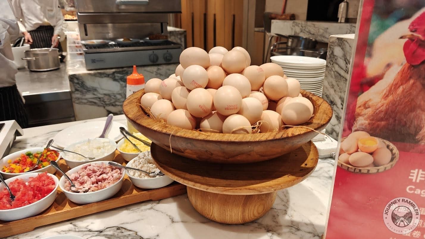 some tomatoes, cheese, ham, peppers and other things to cook the eggs with