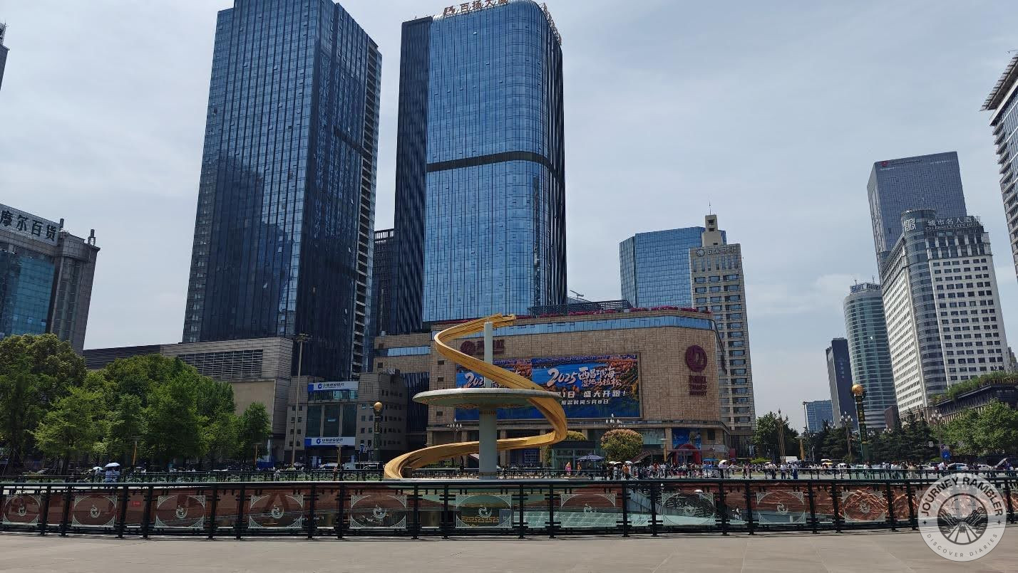square was surrounded by all these tall skyscrapers with large glass windows