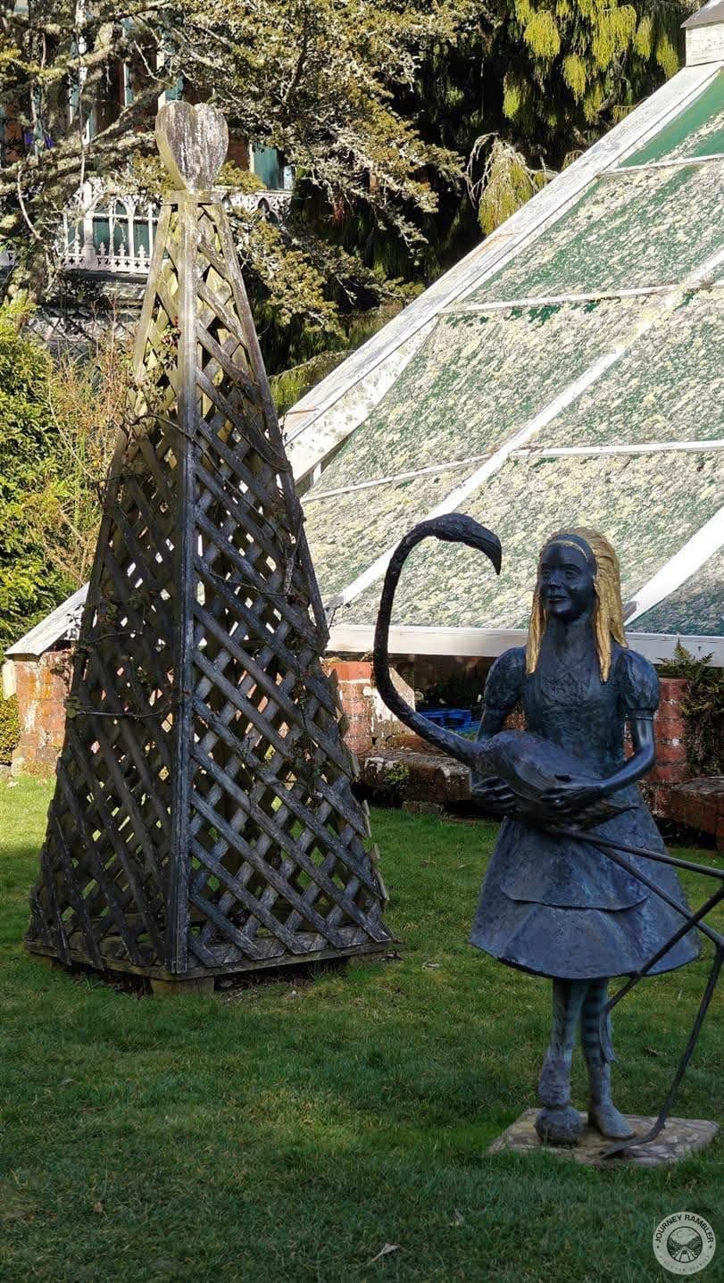 statues near greenhouse