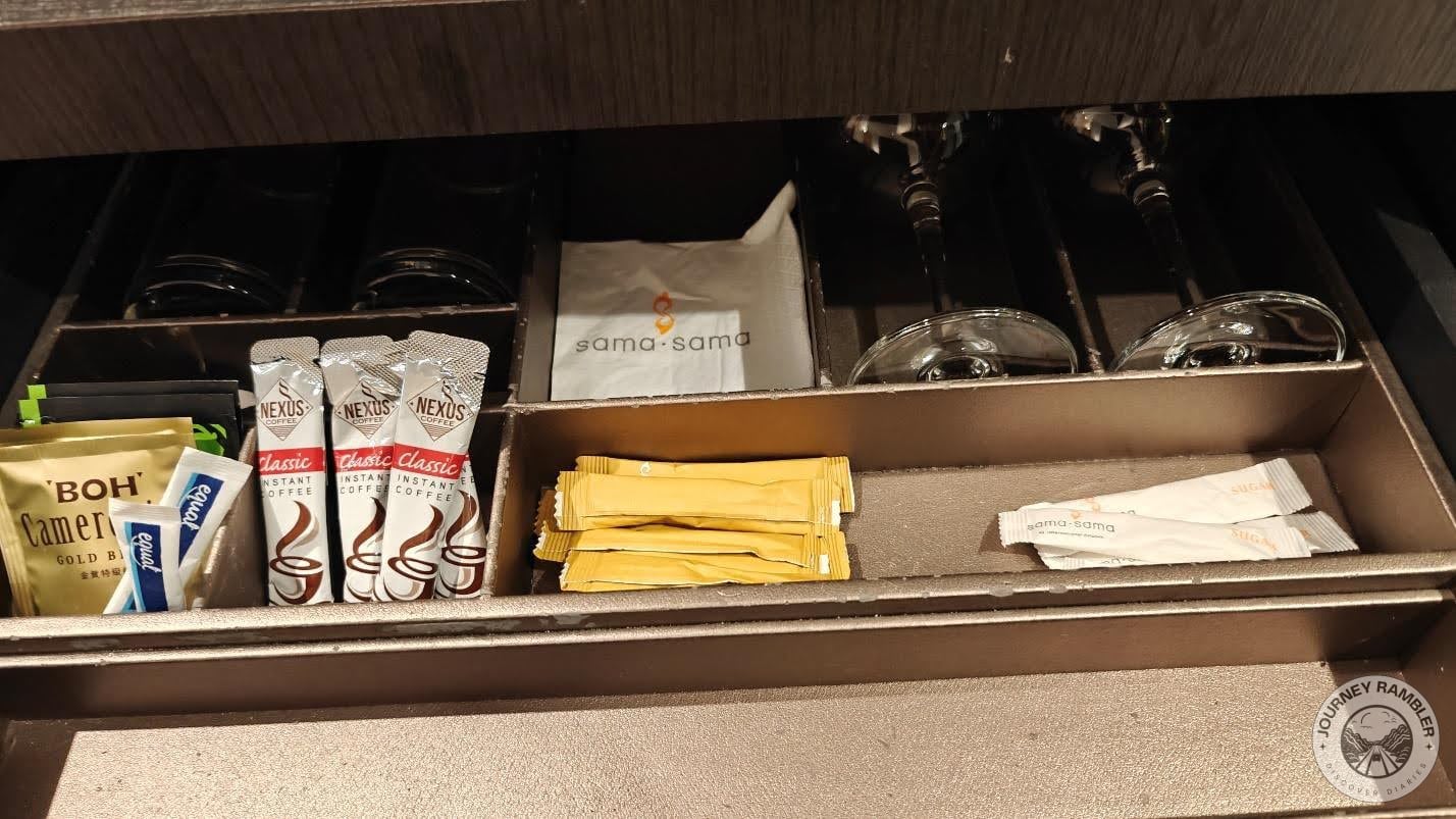 tea, coffee and sugar sachets along with some water glasses