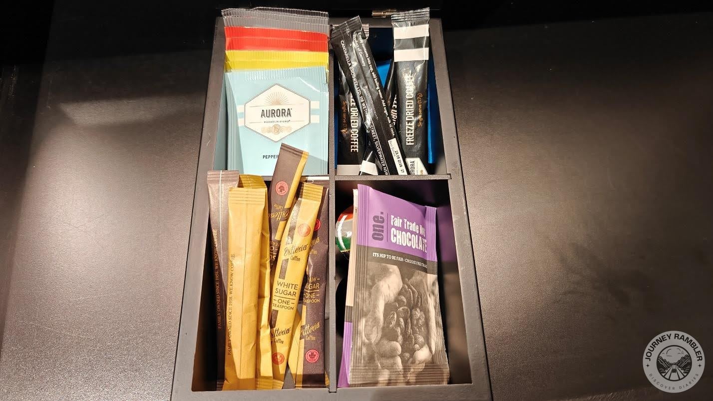 tea, coffee, cookies and sugar sachets