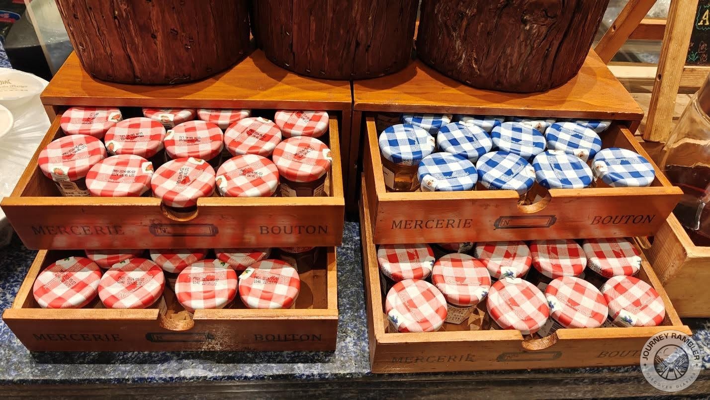 the little jam jars stuffed inside the wooden drawers