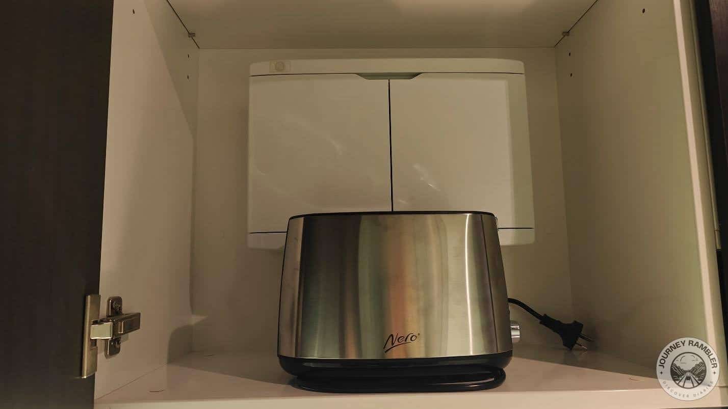 toaster inside one of the cabinets