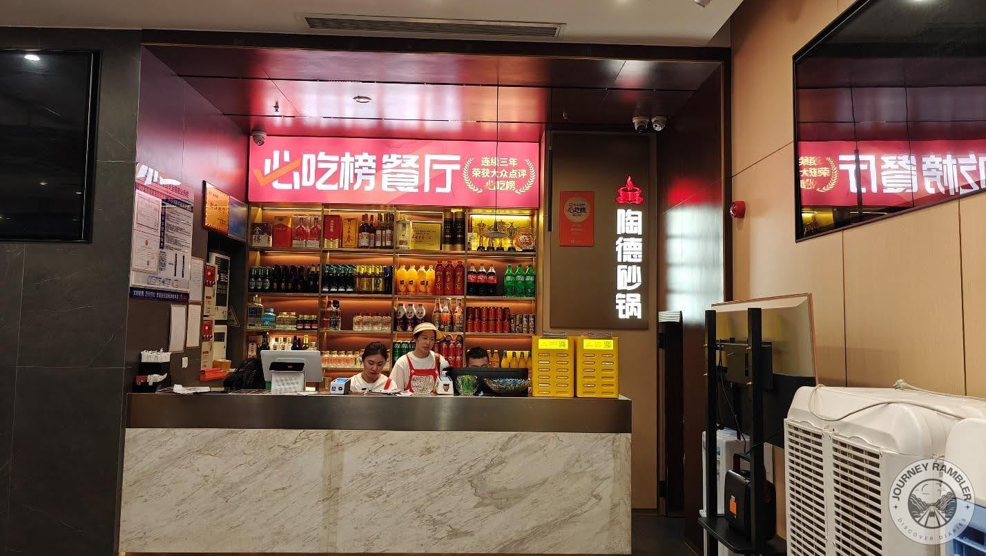 two staff members behind the counter