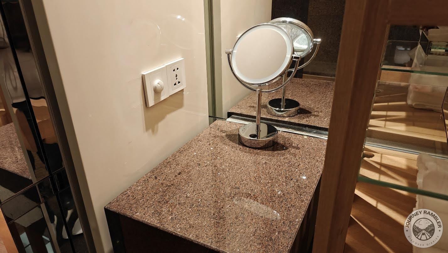 vanity area with a mirror