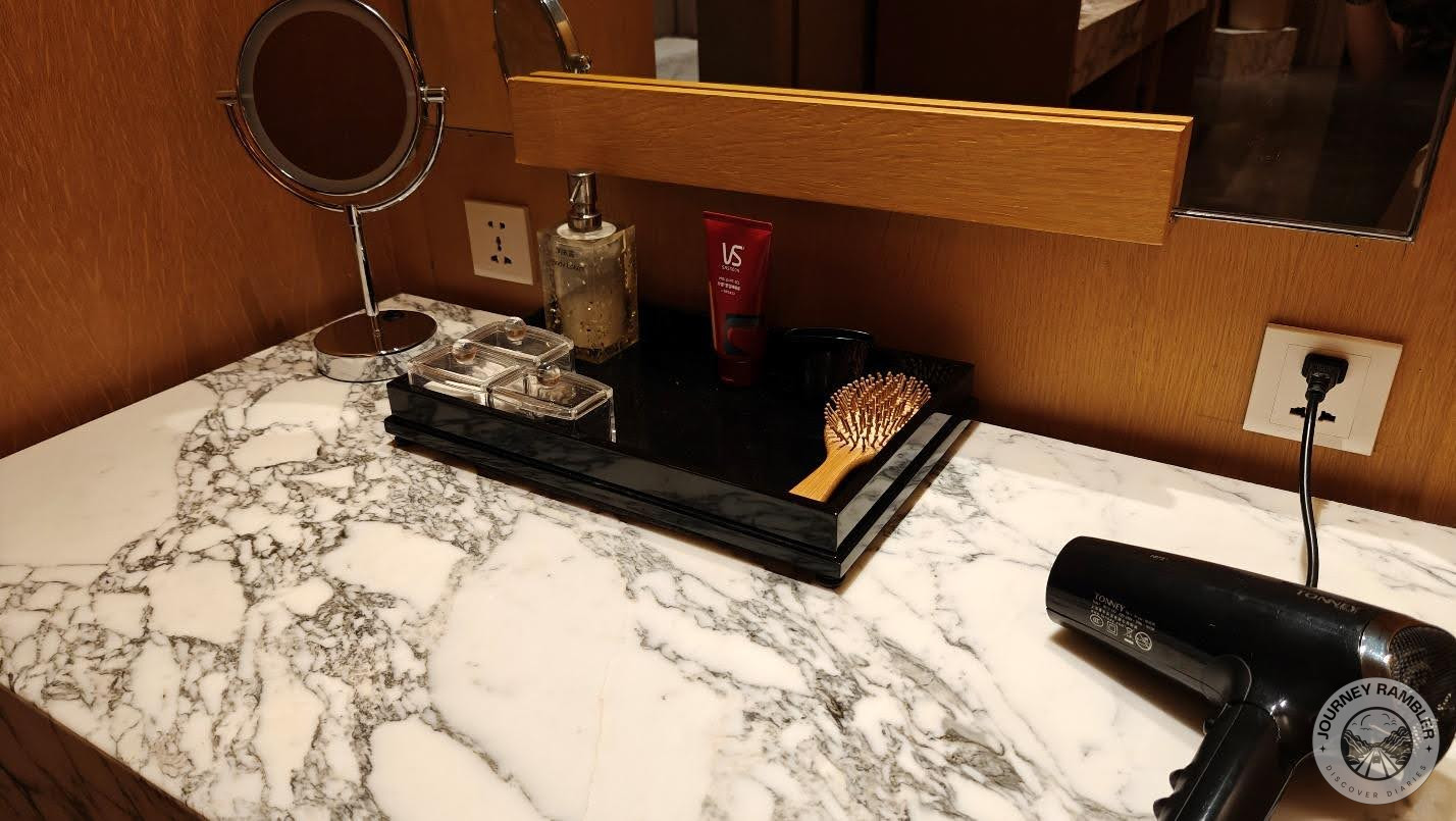 vanity station had hairdryers and brushes