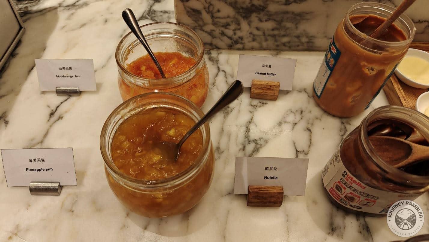 variety of jams, peanut butter and Nutella