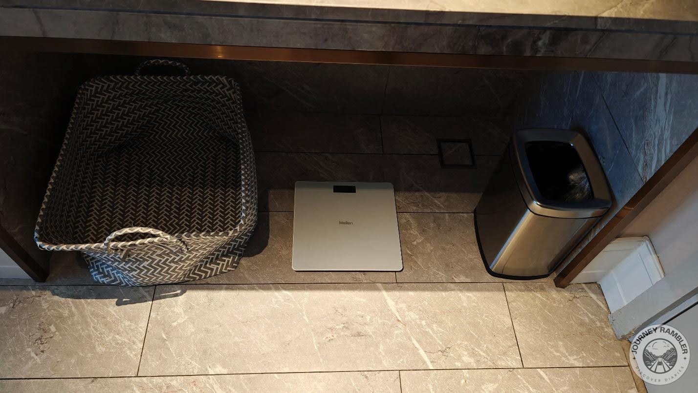 weighing machine, a waste paper basket and a cloth laundry basket