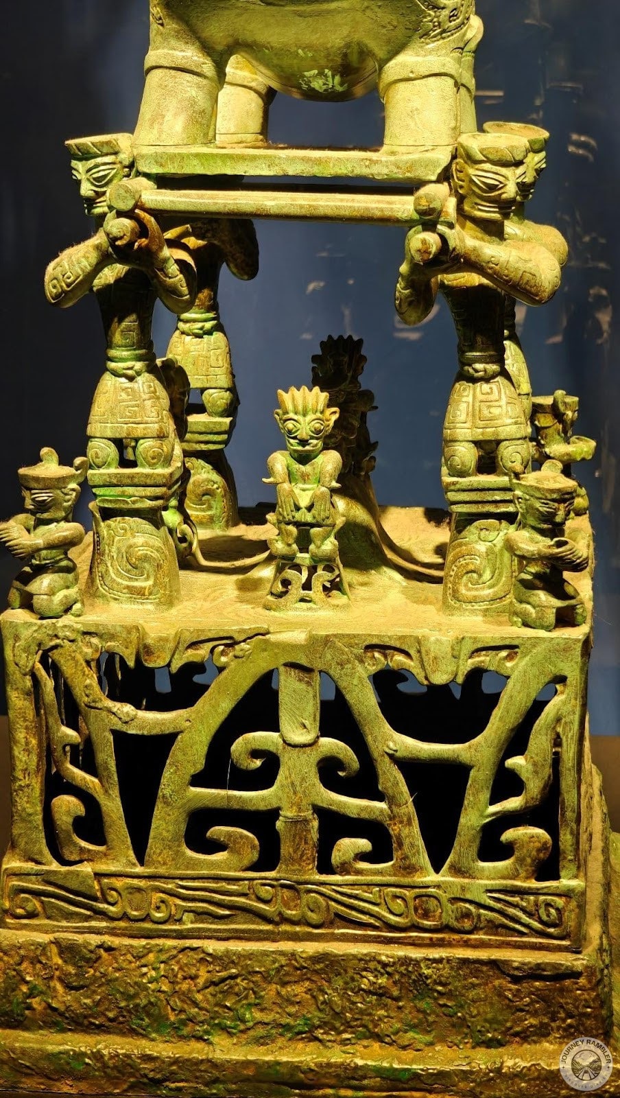 where four humans were carrying a deity of some kind on their shoulders