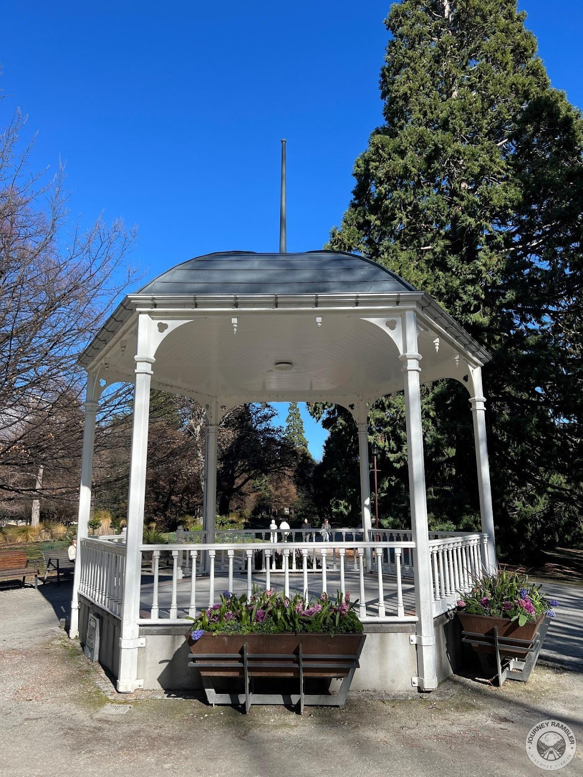 white rotunda with wooden fences on all sides