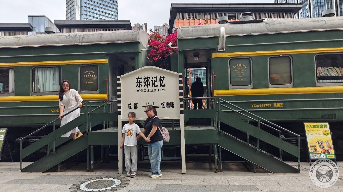 couple of old train carriages parked in one corner