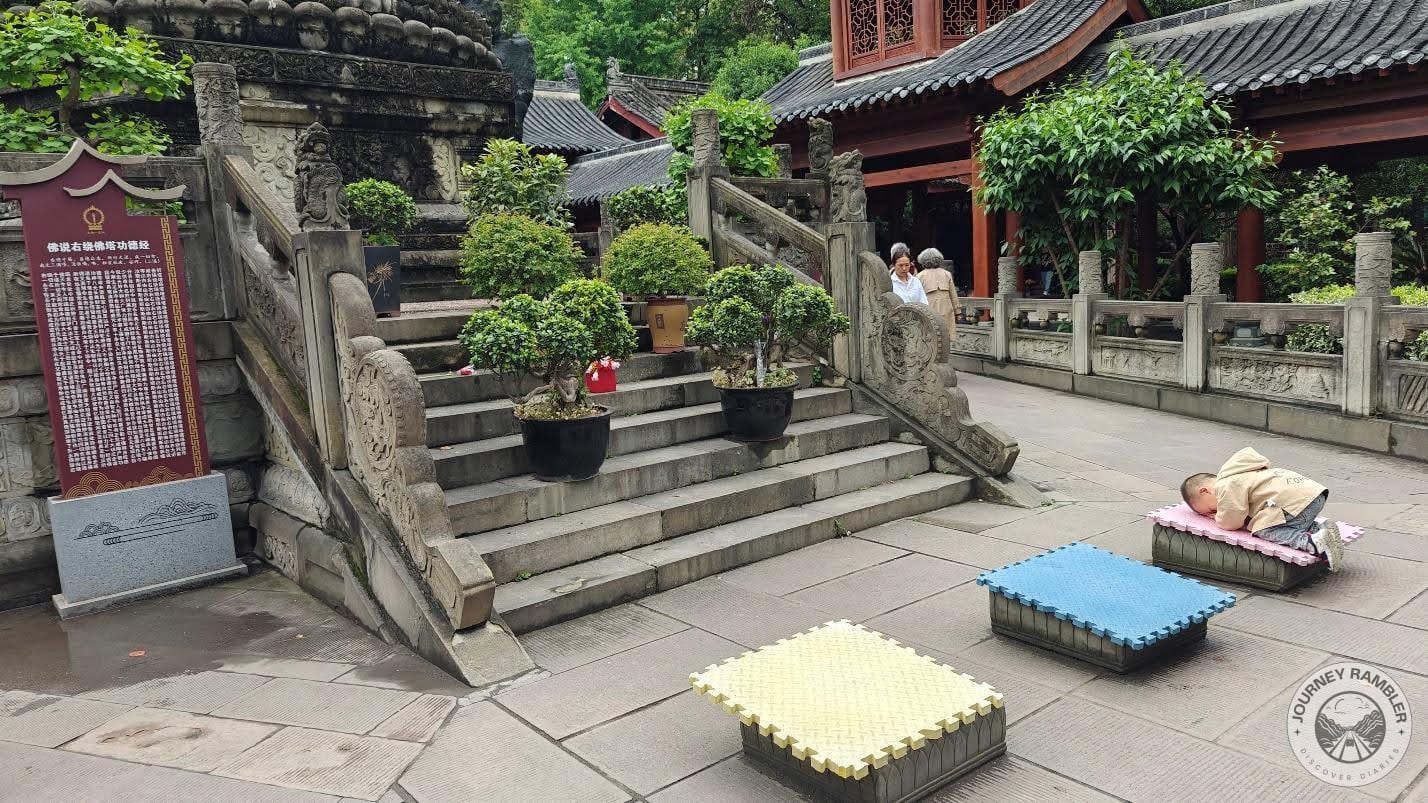 elevated platforms which have cushions where visitors can then use to pay reverence to the Buddhas