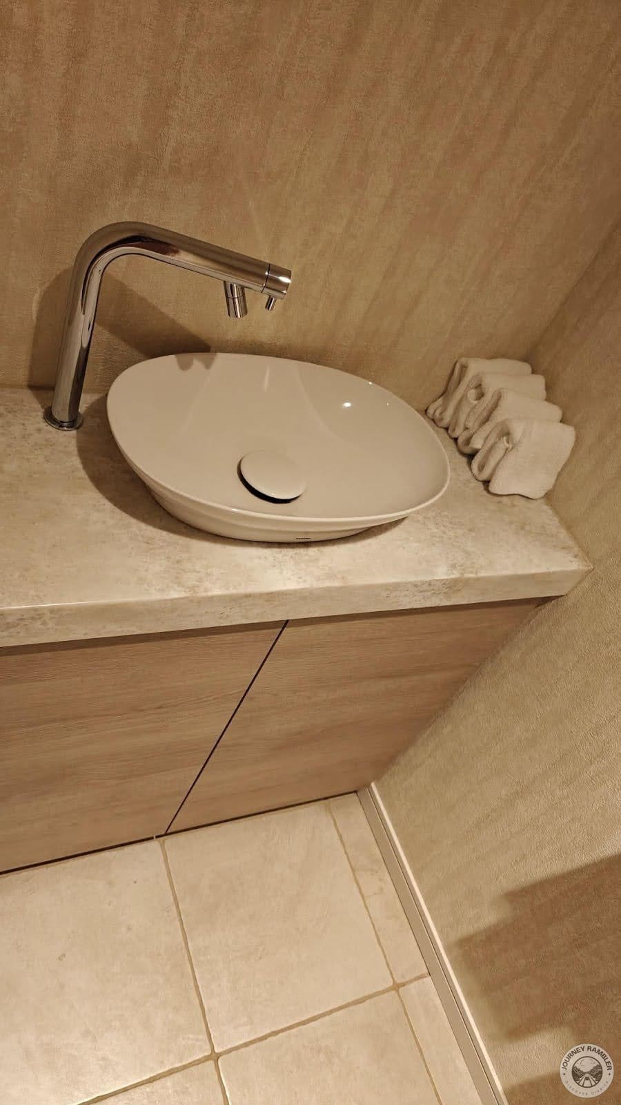 extra washbasin inside the main bathroom area