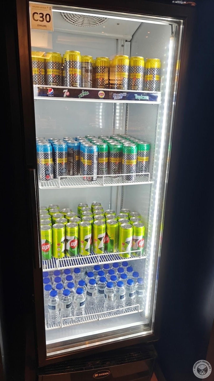 large refrigerators stuffed with cans of soda and water bottles