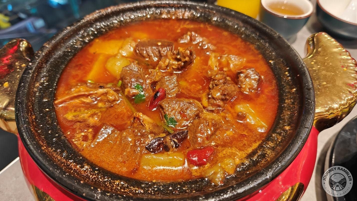 meat stew was served in a traditional looking pot