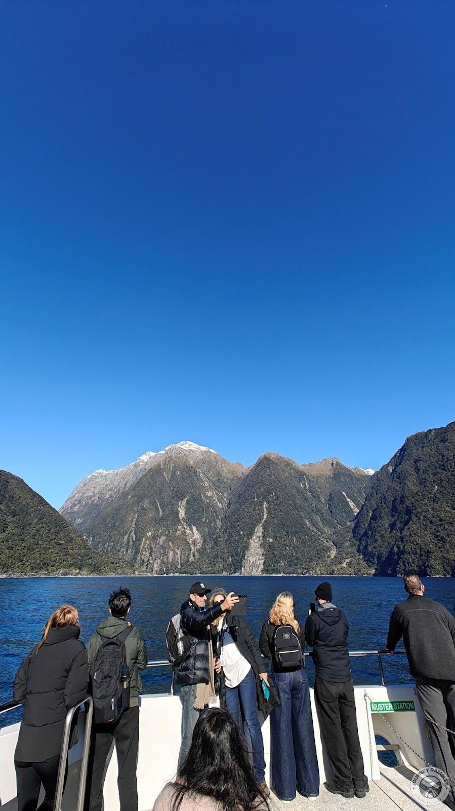 people looking at Cascade Peak up close