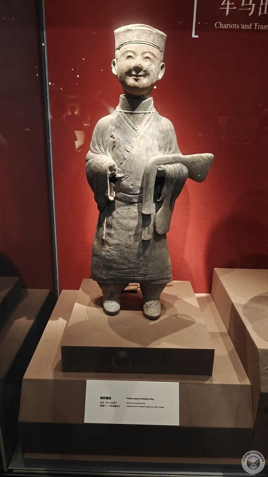 statue of a smiling man