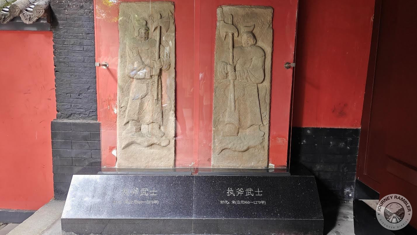 stone reliefs of two warriors