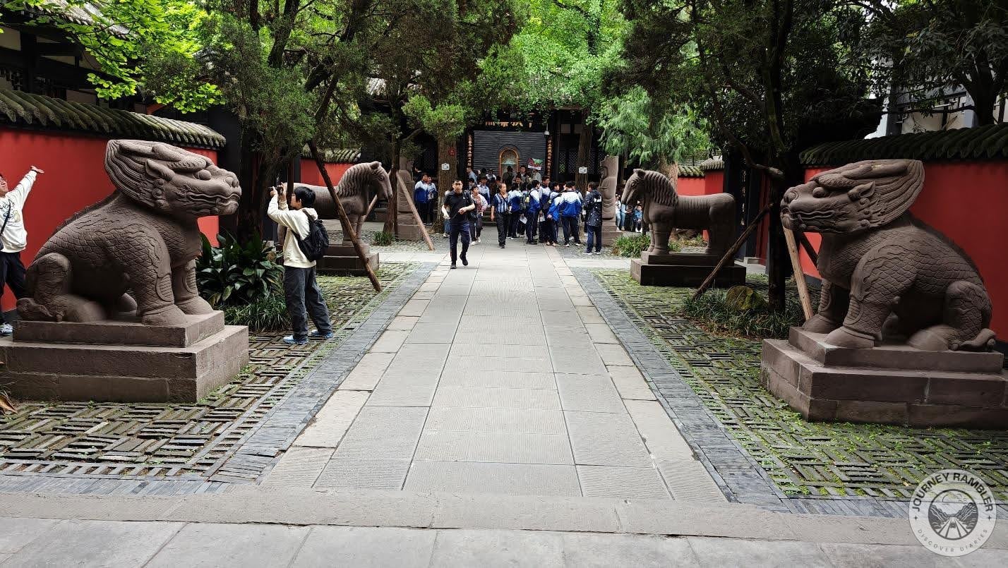 walkway with statues lining its sides