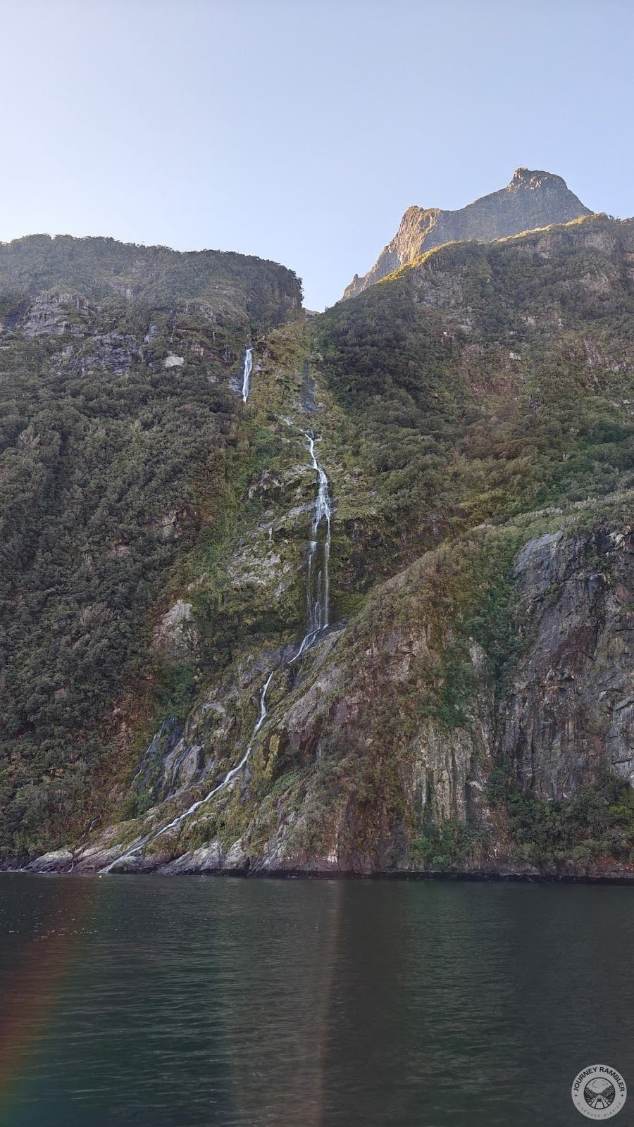 waterfalls here are fed by glacial runoff from the numerous mountains surrounding the fiord