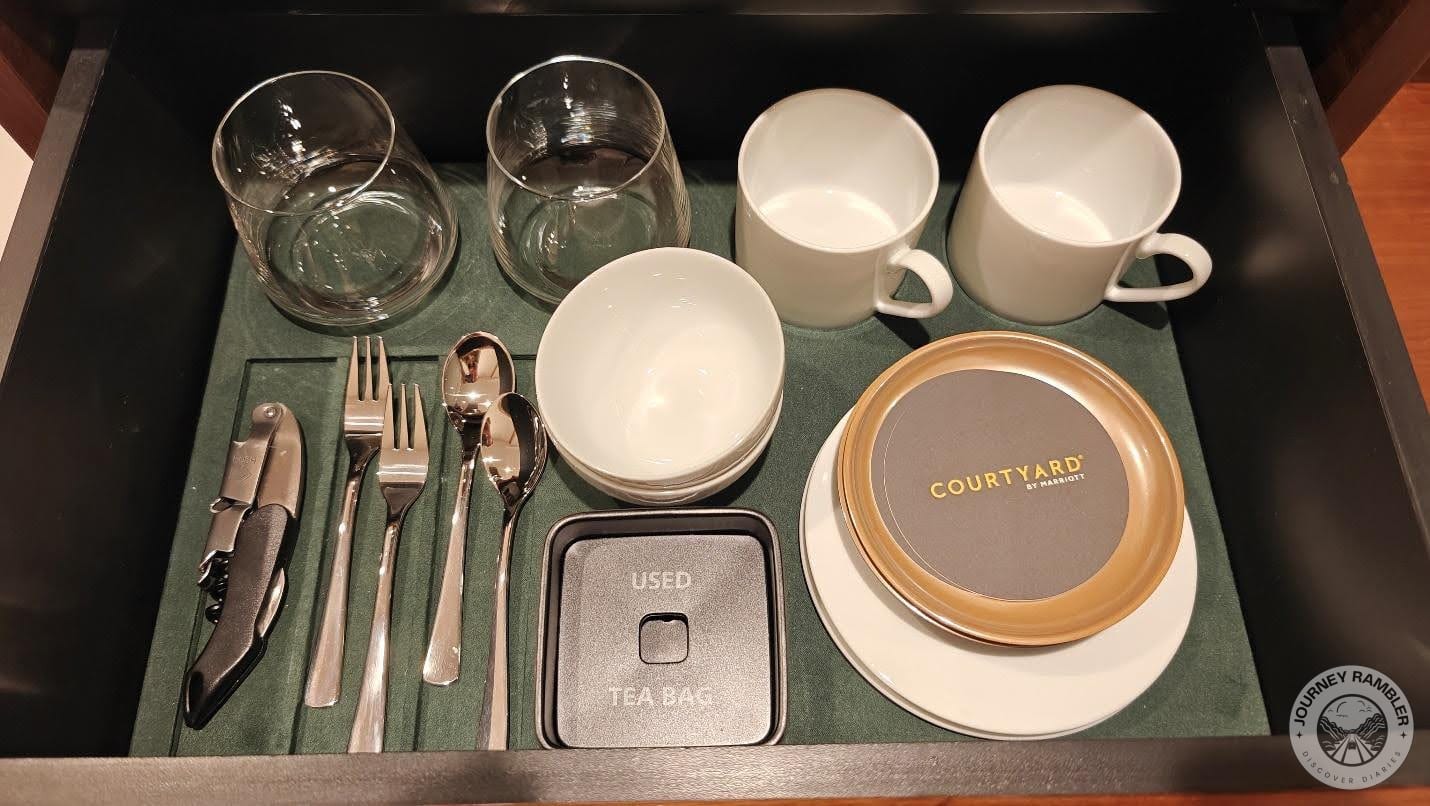 Glasses, spoons, cups and saucers