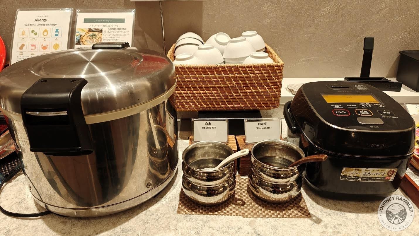 Large hot cases of Japanese steamed rice and egg porridge