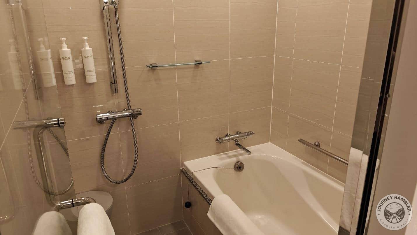 bath area was behind a glass wall and door